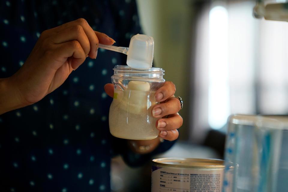 Olivia Godden prepares a bottle of baby formula for her infant son, Jaiden, Friday, May 13, 2022, at her home in San Antonio.