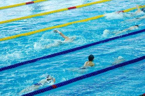 <span class="caption">The busier the pool, the worse it is.</span> <span class="attribution"><a class="link " href="https://www.shutterstock.com/image-photo/some-students-swim-racing-indoor-pool-96243236?src=rL0vSDm5a41Y094aKPZfvA-1-18" rel="nofollow noopener" target="_blank" data-ylk="slk:Shutterstock;elm:context_link;itc:0;sec:content-canvas">Shutterstock</a></span>