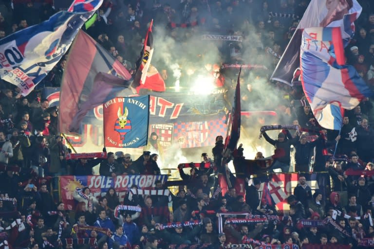 Bologna's supporters light fireworks during the Serie A football match Bologna vs Fiorentina at "Renato Dall'Ara" Stadium in Bologna on Febrauary 6, 2016