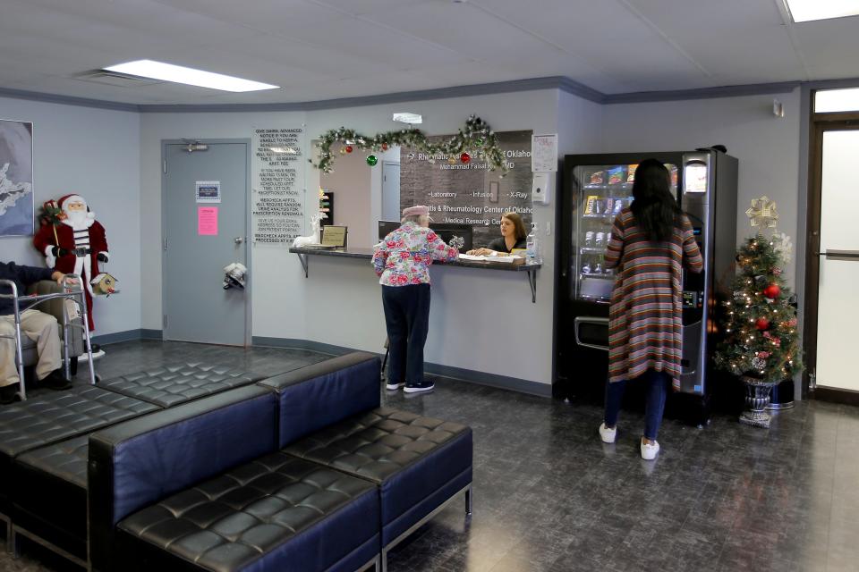 Holiday decorations welcome patients in the lobby of Nyla Khan's rheumatic clinic in Oklahoma City.