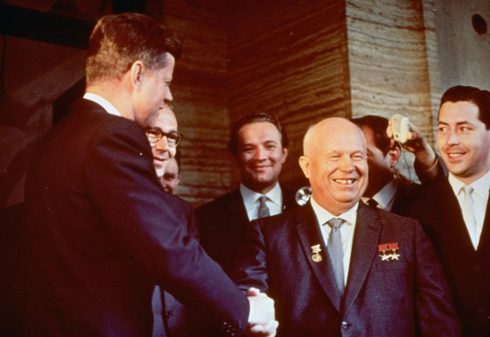 Under Nikita Khrushchev (pictured, shaking hands with JFK), the size of the Russian army was cut back, with funds instead poured into welfare for the population. AP original.
