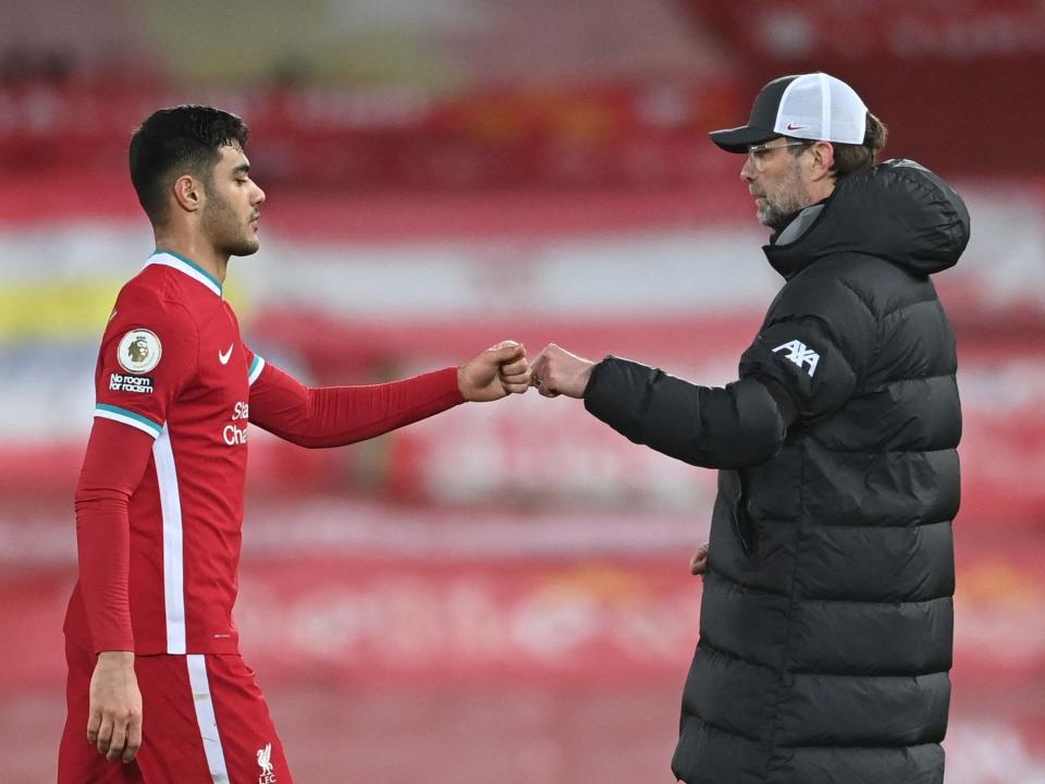 Liverpool manager Jurgen Klopp and defender Ozan Kabak (POOL/AFP via Getty Images)