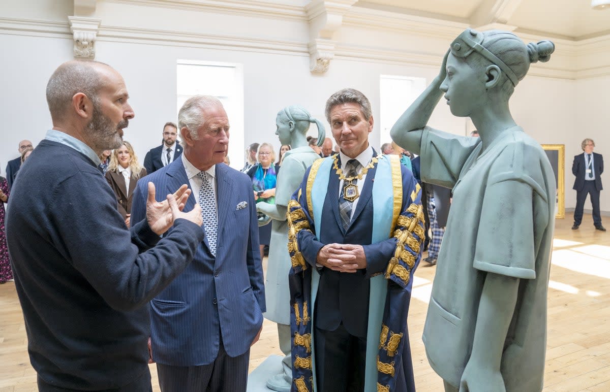 The Prince of Wales, centre, with sculptor Kenny Hunter, left, and Professor Michael Griffin (Jane Barlow/PA) (PA Wire)