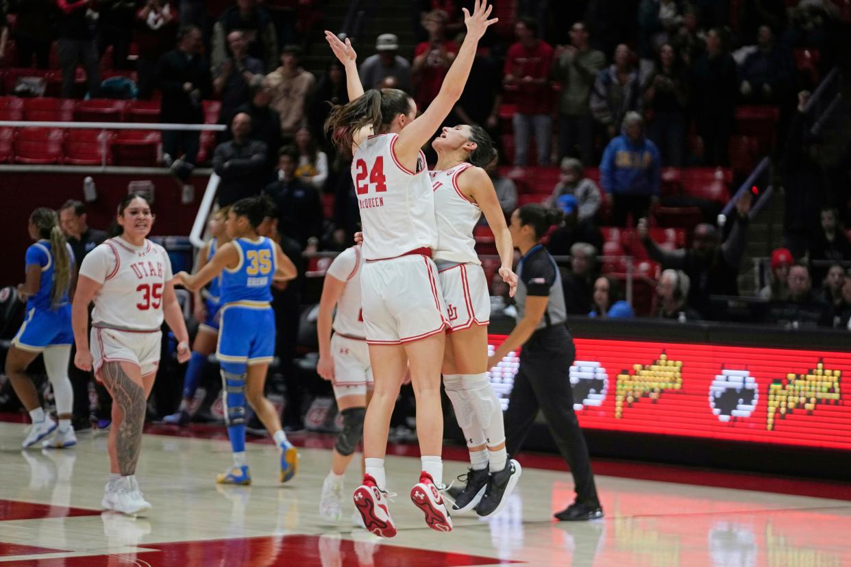 Utah's Ines Vieira, right, celebrates with Kennady McQueen (24) after scoring the tying point before going into overtime during the game against UCLA, Monday, Jan. 22, 2024, in Salt Lake City.