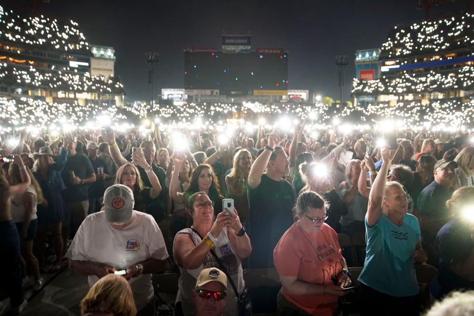 Fans hold up their phones during Keith Urban's performance during CMA Fest at Nissan Stadium Friday, June 10, 2022 in Nashville, Tennessee.