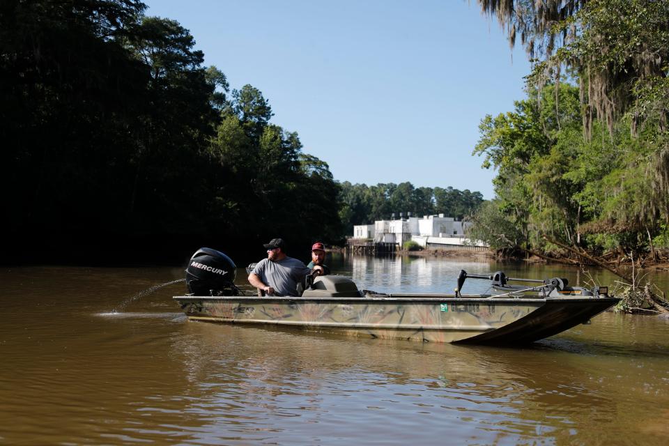 Fishermen launch their boat from the Abercorn Creek boat ramp,  just in sight of the City of Savannah's water facility.