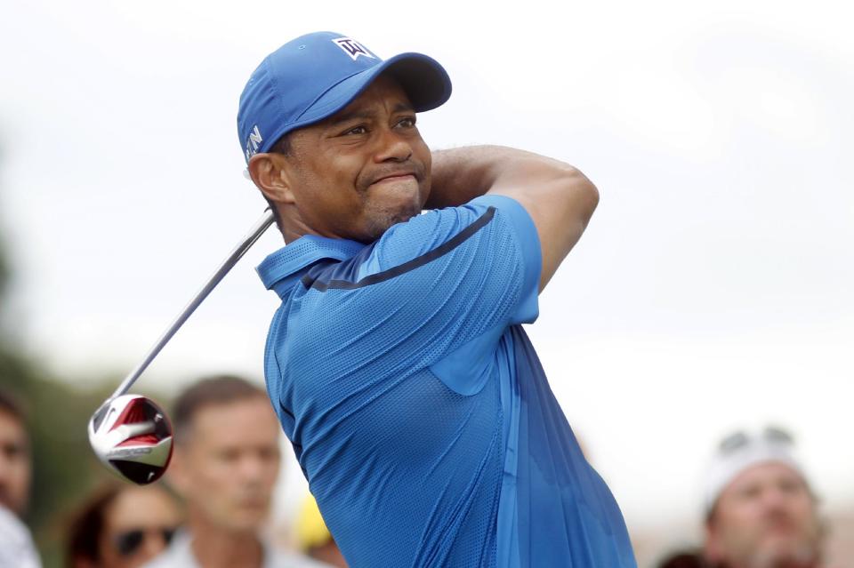 Tiger Woods hits from the second tee during the first round of the Cadillac Championship golf tournament Thursday, March 6, 2014, in Doral, Fla. (AP Photo/Marta Lavandier)