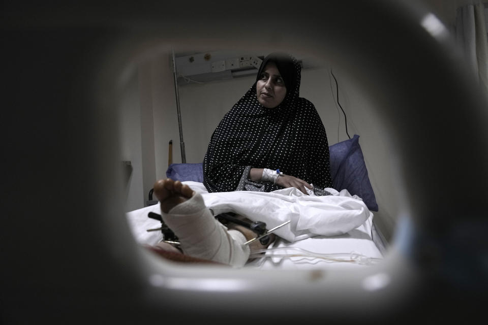 Shaima, a Palestinian woman who was injured during the war in Gaza, receives medical care at Al Arish hospital, Egypt, Monday, Nov. 27, 2023. (AP Photo/Amr Nabil)