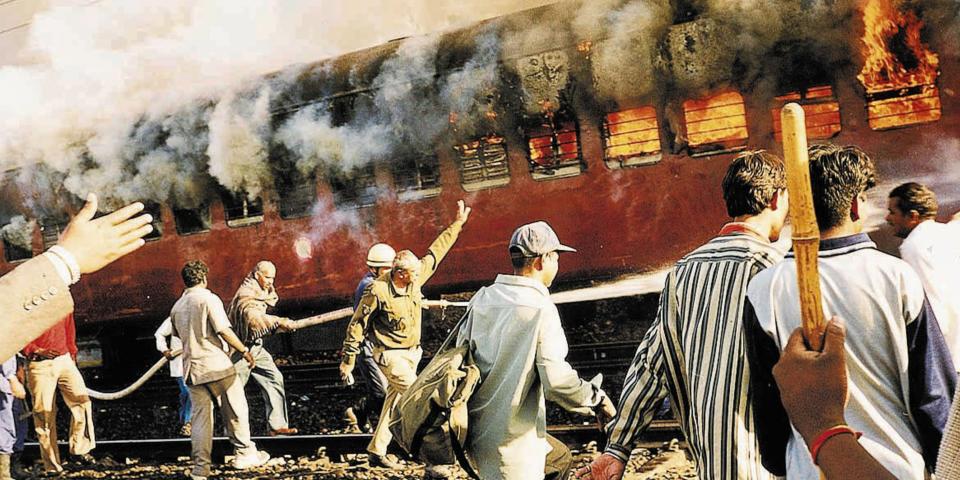 A train was set on fire by a Muslim mob in Godhra on February 27, 2002. As many as 59 Hindu kar sevaks returning from Ayodhya were burnt alive in the fire and this triggered the deadly Hindu-Muslim riots Gujarat. AP Photo/Stringer