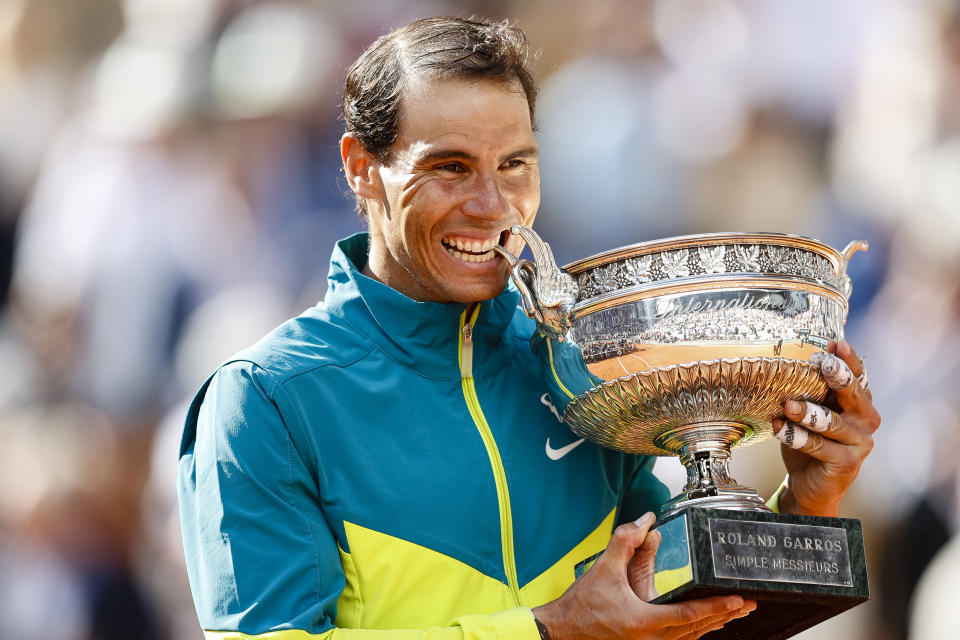 Rafa Nadal (pictured) celebrates his victory with the Musketeers Cup at the French Open.