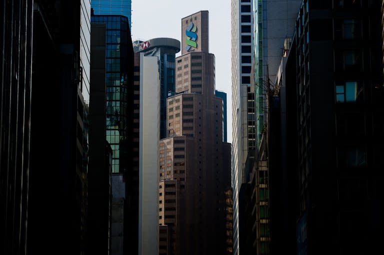 The Standard Chartered Bank building is seen in Hong Kong in August 2012. Standard Chartered, also listed on the Hong Kong exchange, was 0.70 percent higher at HK$186.00 after it paid US authorities $327 million to settle charges it violated US sanctions on Iran and Myanmar