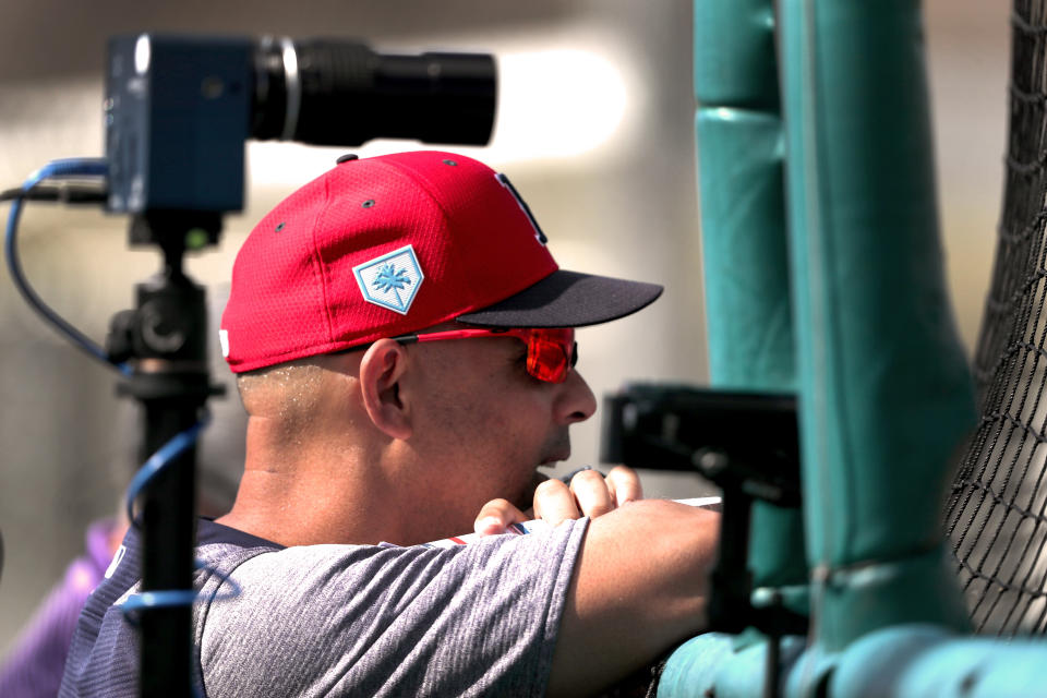 FORT MYERS, FL - FEBRUARY 17: Boston Red Sox manager Alex Cora is framed by a high speed camera as he watches a live batting practice session during a spring training workout at JetBlue Park in Fort Myers, FL on Feb. 17, 2019. (Photo by Barry Chin/The Boston Globe via Getty Images)