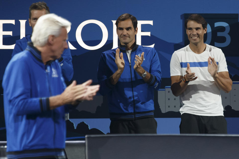 Team Europe's Captain, Bjorn Borg, left, with Team Europe's players Roger Federer, center, and Rafael Nadal, right, applaude at the Laver Cup tennis event in Geneva, Switzerland, Saturday, Sept. 21, 2019. (Salvatore Di Nolfi/Keystone via AP)