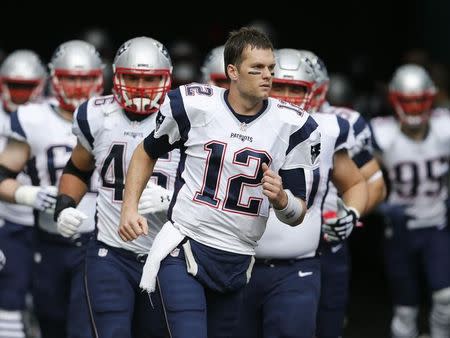 Jan 1, 2017; Miami Gardens, FL, USA; New England Patriots quarterback Tom Brady (12) leads his team out of the tunnel before an NFL football game against the Miami Dolphins at Hard Rock Stadium. The Patriots won 35-14. Mandatory Credit: Reinhold Matay-USA TODAY Sports