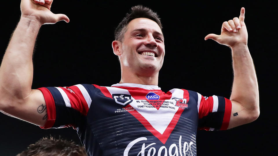 Cooper Cronk, pictured here celebrating the Roosters' grand final triumph.