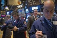Traders work on the floor of the New York Stock Exchange January 8, 2015. REUTERS/Brendan McDermid