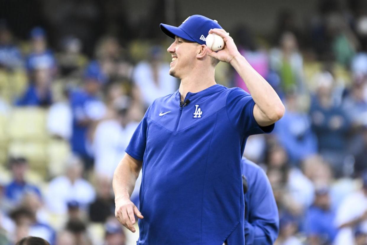 Walker Buehler throws out the first pitch left-handed before Game 2 of the NLDS against San Diego in October 2022.