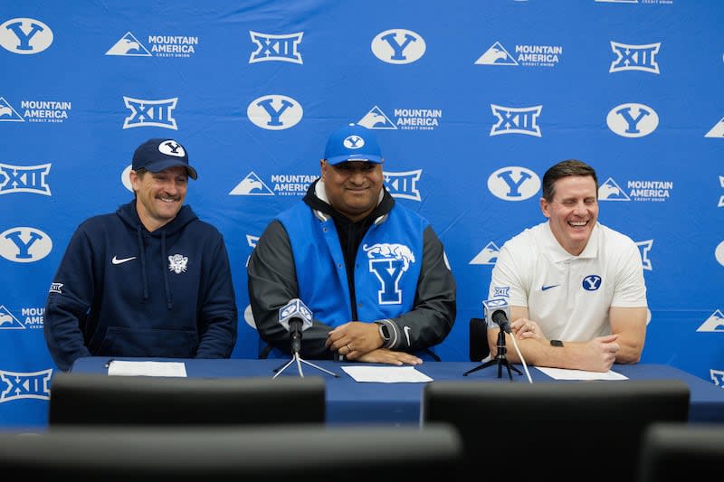 BYU coach Kalani Sitake, center, is flanked by offensive coordinator Aaron Roderick, left, and defensive coordinator Jay Hill 23FTB Signing Day 106 23FTB Signing Day December 20, 2023 © BYU PHOTO 2023 All rights reserved photo @byu.edu (801)422- 7322