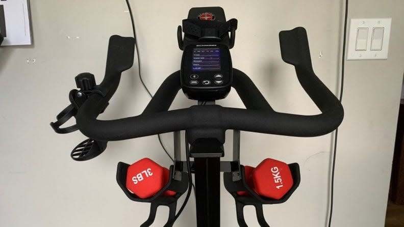 Schwinn's IC4 Indoor Cycling Bike comes with a Bluetooth-enabled heart rate tracker, a pair of three-pound weights, a built-in media rack and a USB charging port.