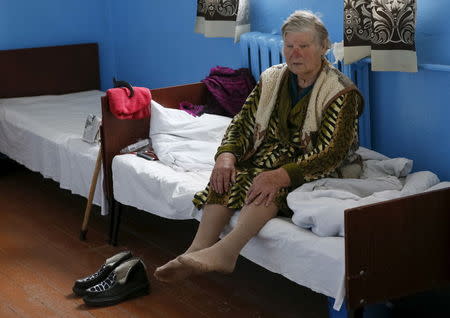 A patient sits on a bed at a clinic in the village of Staiky, south of Kiev, Ukraine, November 9, 2015. REUTERS/Valentyn Ogirenko