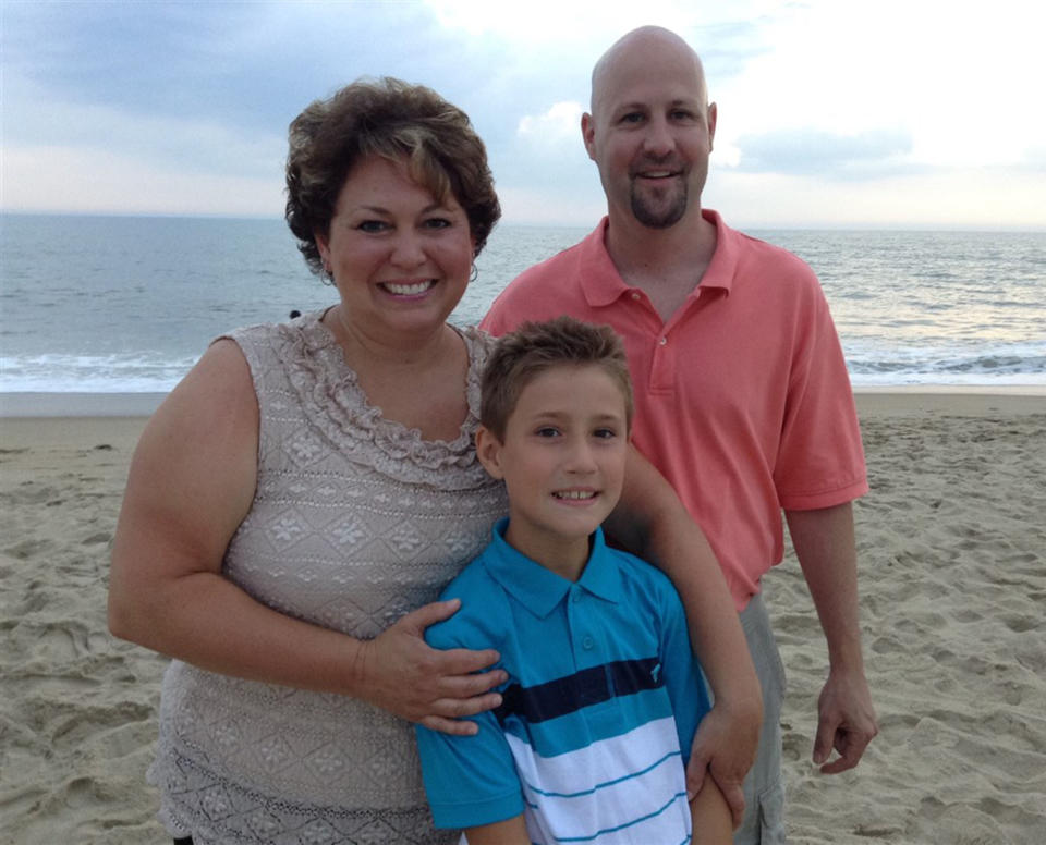 Tricia Seaman and her husband Dan pose with Wesley.