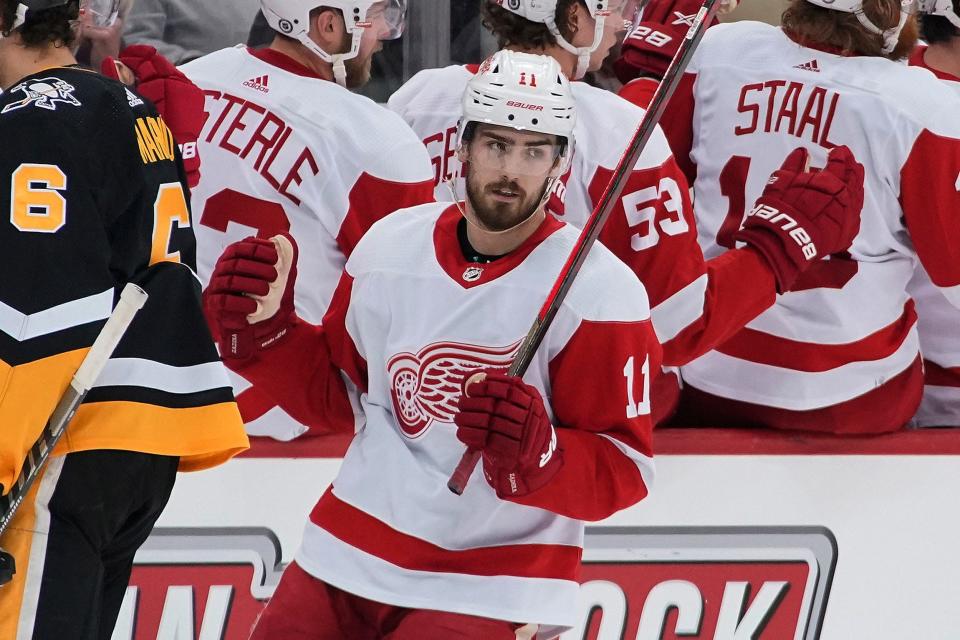 Detroit Red Wings&#39; Filip Zadina (11) returns to the bench after scoring during the second period of an NHL hockey game against the Pittsburgh Penguins in Pittsburgh, Friday, Jan. 28, 2022.
