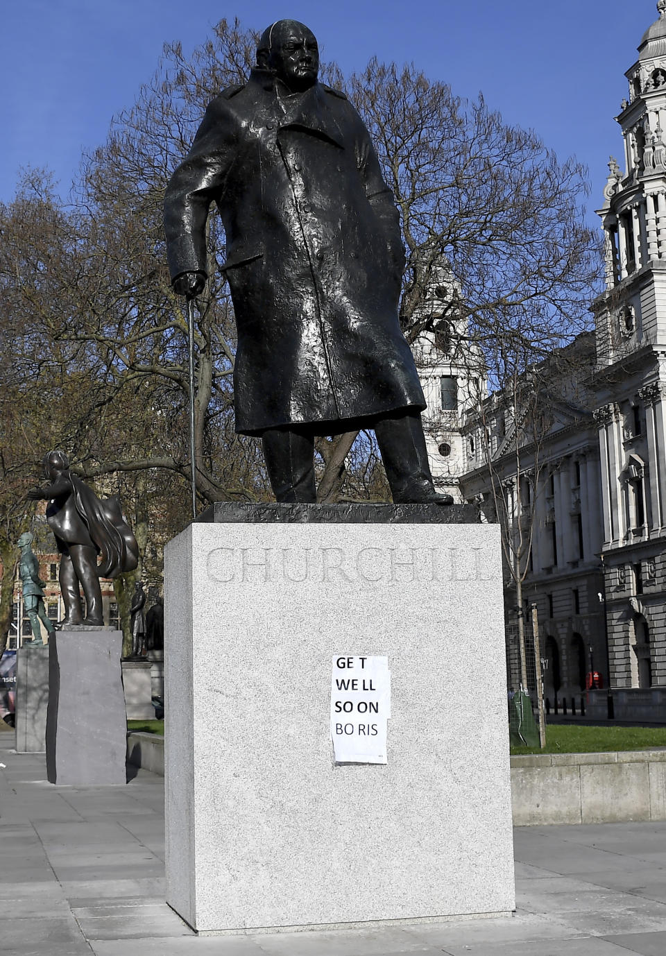 People have put a paper saying 'Get Well Soon Boris' on the statue of Winston Churchill in central London as British Prime Minister Boris Johnson was moved to intensive care after his coronavirus symptoms worsened in London, Tuesday, April 7, 2020. Johnson was admitted to St Thomas' hospital in central London on Sunday after his coronavirus symptoms persisted for 10 days. Having been in hospital for tests and observation, his doctors advised that he be admitted to intensive care on Monday evening. The new coronavirus causes mild or moderate symptoms for most people, but for some, especially older adults and people with existing health problems, it can cause more severe illness or death.(AP Photo/Alberto Pezzali)