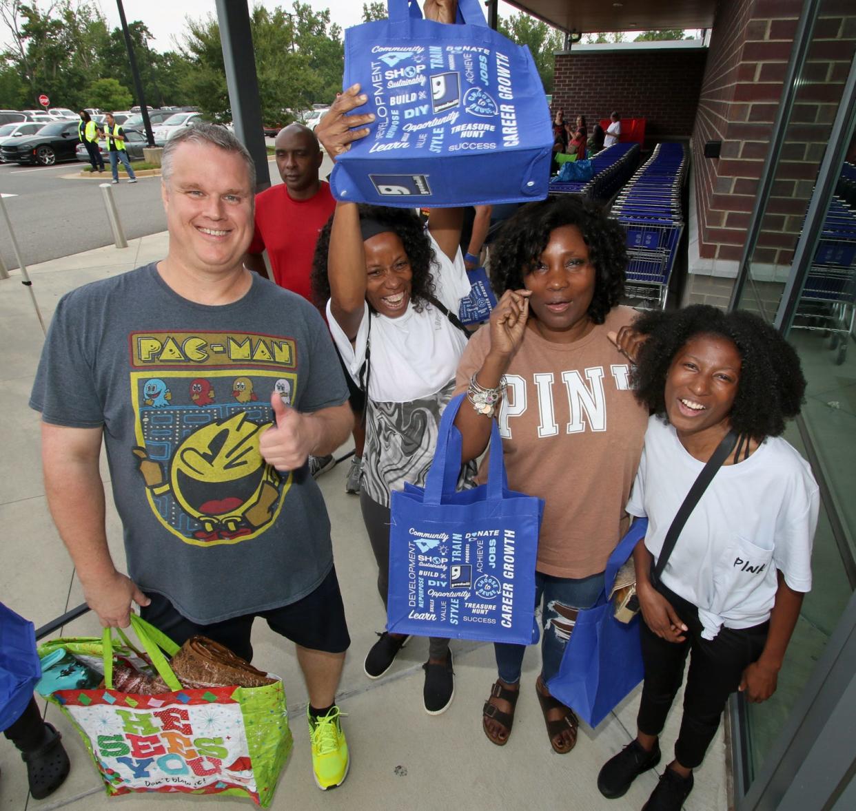 Michael McDaniel, Angela Bates, Alene Bates and Malika Bates arrived at 4 a.m. so they would be the first customers inside the new Goodwill store on East Dixon Boulevard Friday morning, August 26, 2022.