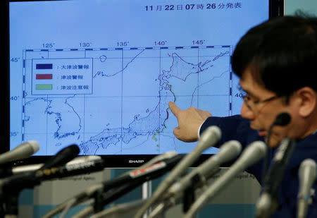 Japan Meteorological Agency's earthquake and volcano observations division director Koji Nakamura points at a map showing earthquake information during a news conference in Tokyo, Japan November 22, 2016. REUTERS/Toru Hanai