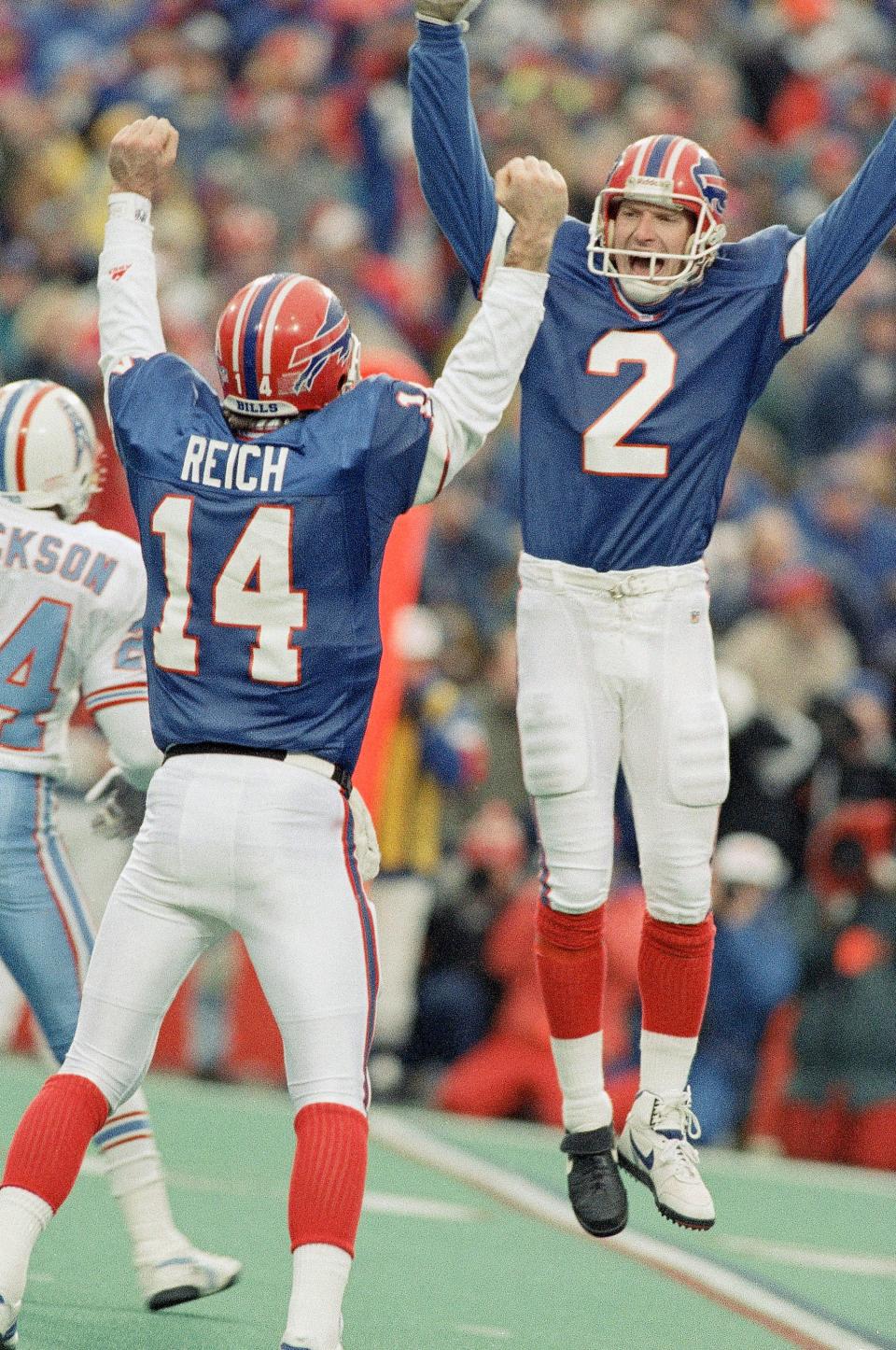 Buffalo Bills kicker Steve Christie, right, celebrates his game-winning field goal with quarterback Frank Reich as the Bills beat the Houston Oilers in overtime 41-38 on Jan. 3, 1993 in Orchard Park.