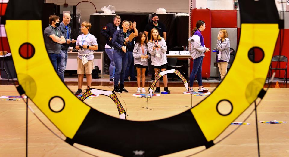 Students from Viera Elementary School fly their  Unmanned Aerial Systems (drones) through the obstacle course in the gymnasium at Satellite High during the Innovation Games.