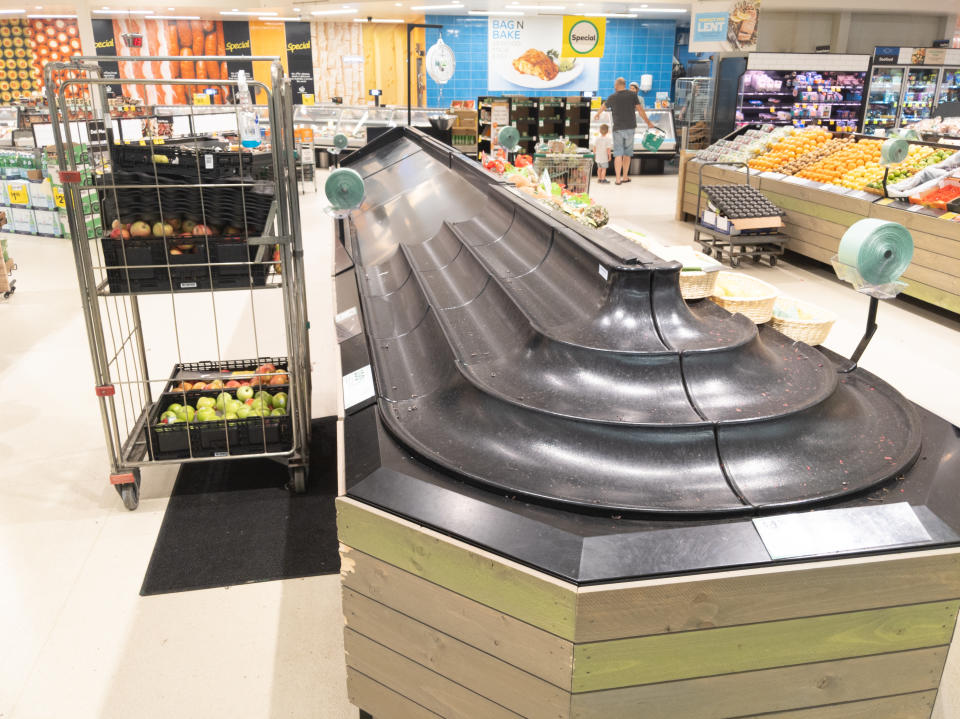 Empty fruit and vegetable shelves in an Australian supermarket after panic buying due to the COVID-19 Coronavirus. Source: Getty