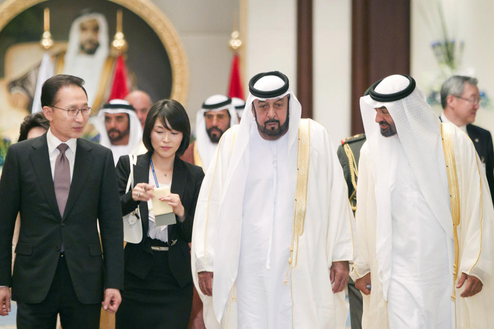 FILE - In this photo made available by Emirates News Agency, WAM, Monday March 14, 2011, South Korean President Lee Myung Bak, left, meets UAE president Sheik Khalifa bin Zayed Al-Nahyan, 2nd right, and UAE Crown Prince Sheik Mohammed bin Zayed Al-Nahyan in Abu Dhabi, UAE, Sunday March 13, 2011. Sheikh Khalifa died Friday, May 13, 2022, the government's state-run news agency announced in a brief statement. He was 73. (AP Photo/WAM-HO, File)