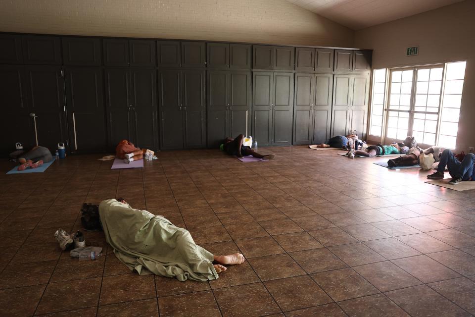 People seeking shelter from the heat rest at the First Church UCC cooling center amid the city's worst heat wave on record on July 25, 2023 in Phoenix, Arizona.