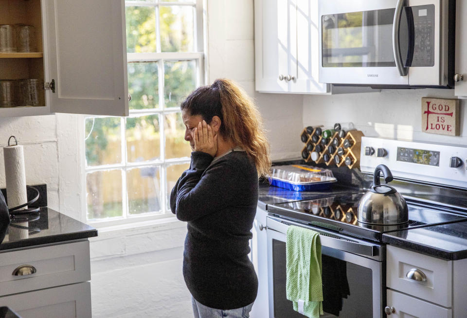 Mario Campos, 52, stands in the kitchen of El Refugio, an organization that houses families visiting loved ones at the nearby Stewart Detention Center, before she visits her son, Sunday, Nov. 10, 2019, in Lumpkin, Ga. Campos' son was deported a year ago from the same ICE facility where another son is now detained. "It's mixed emotions," said Campos of having to return to visit. "I'm happy to see my son but I feel guilty I'm not doing enough," said Campos. "I think in another state, another place, they have more help from the lawyers. We're still praying." (AP Photo/David Goldman)