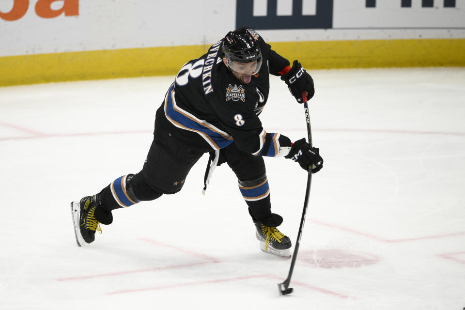 Washington Capitals left wing Alex Ovechkin (8) shoots during the second period of an NHL hockey game against the Winnipeg Jets, Friday, Dec. 23, 2022, in Washington. (AP Photo/Nick Wass)