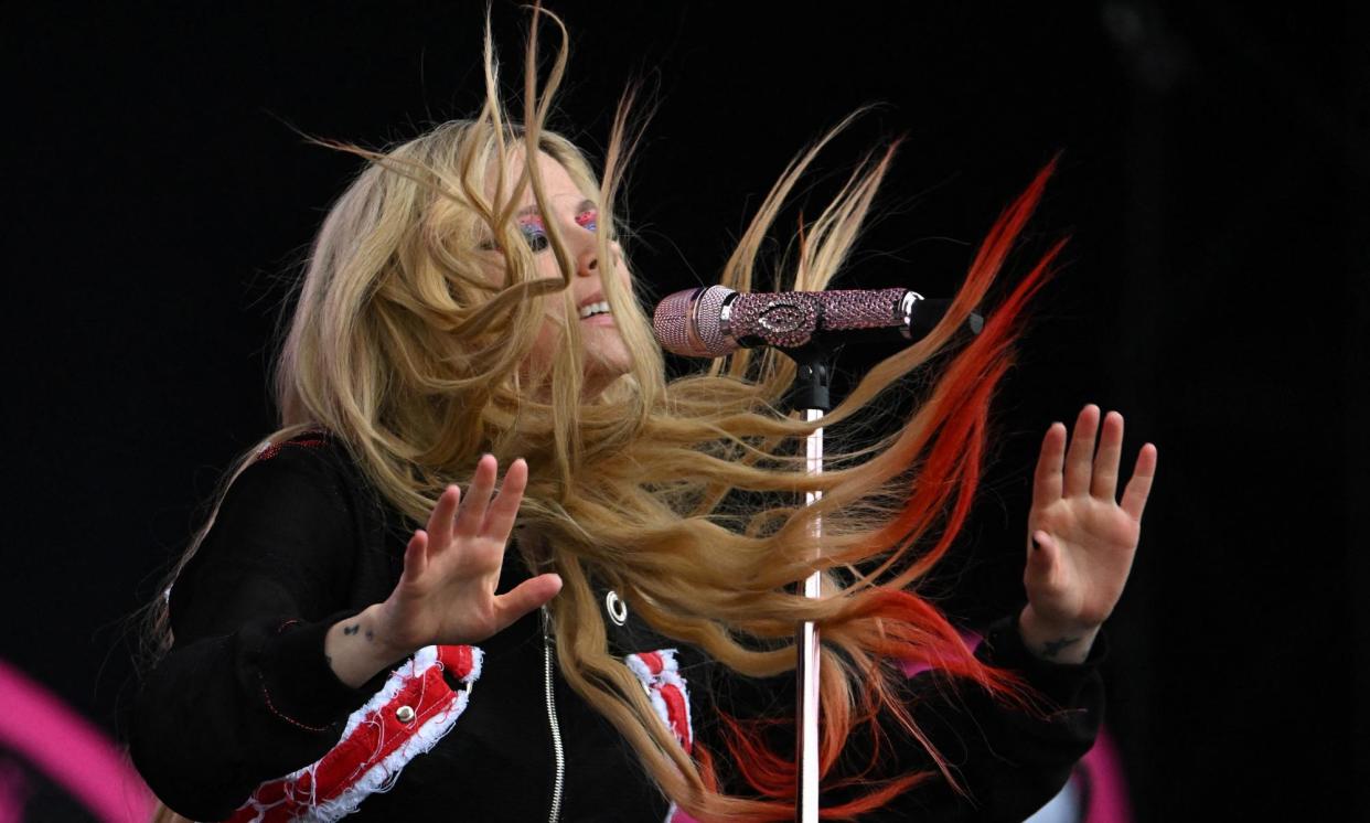 <span>‘Here’s to never growing up’ … Avril Lavigne performing on the Other stage.</span><span>Photograph: Dylan Martinez/Reuters</span>