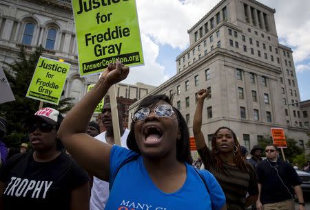 People gather at city hall in Baltimore, Maryland May 2, 2015. REUTERS/Eric Thayer