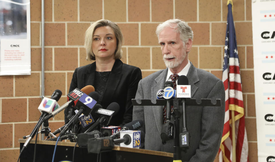 Dr. Tom Wake, the interim administrator of Cook County Animal and Rabies Control, speaks with reporters in Chicago, Thursday, Jan. 9, 2020, while Kelley Gandurski, executive director of the Chicago Animal Care and Control, stands next to him. Authorities were on the hunt for coyotes in downtown Chicago after two reported attacks, including one where passersby said they had to pull a wild canine off of a 6-year-old boy who was bitten in the head. (AP Photo/Teresa Crawford)