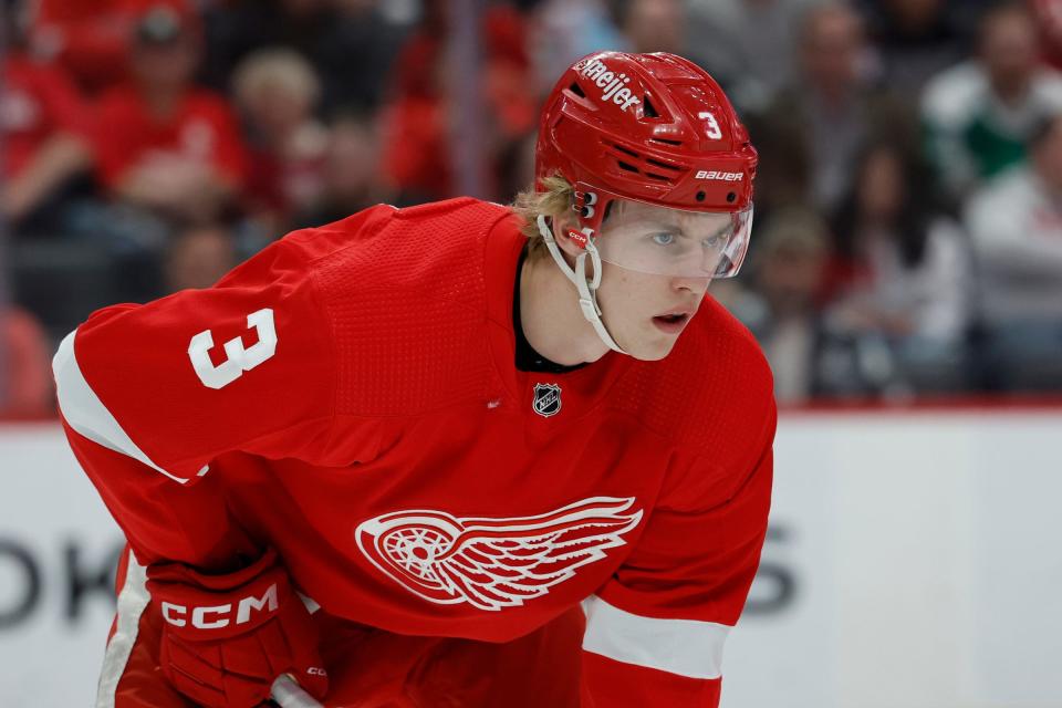 Red Wings defenseman Simon Edvinsson gets set during a faceoff in the first period against the Stars on Monday, April 10, 2023, at Little Caesars Arena.