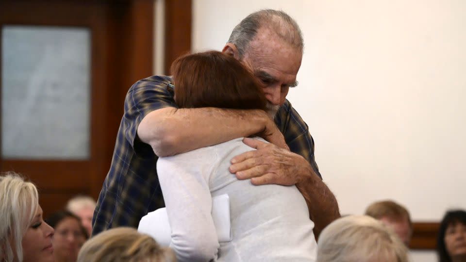 Kay and Larry Woodcock, the grandparents of JJ Vallow, embrace after Kay Woodcock's statement Monday. - Tony Blakeslee/Pool/East Idaho News