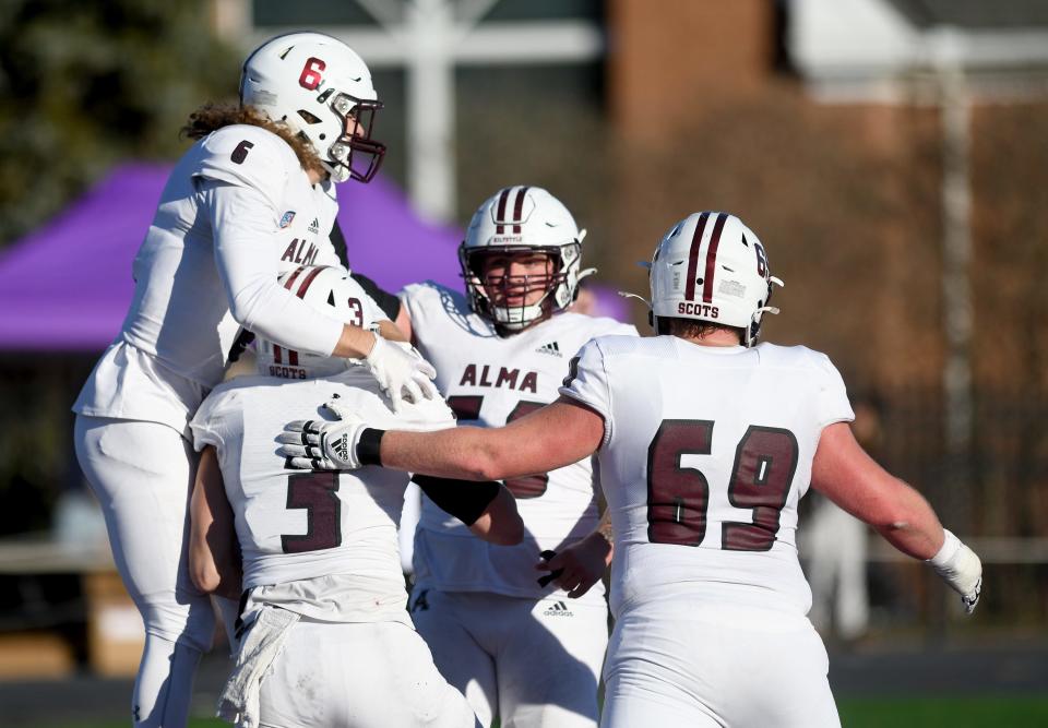 Alma celebrates a fourth-quarter touchdown by Cole Thomas against Mount Union in an NCAA Division III second-round playoff game. Saturday, Nov. 25, 2023.