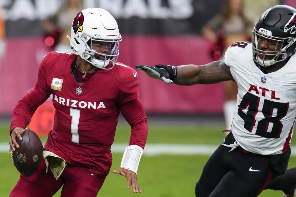 Arizona Cardinals quarterback Kyler Murray (1) runs out of the pocket against Atlanta Falcons linebacker Bud Dupree (48) during the first half of an NFL football game, Sunday, Nov. 12, 2023, in Glendale, Ariz. (AP Photo/Ross D. Franklin)