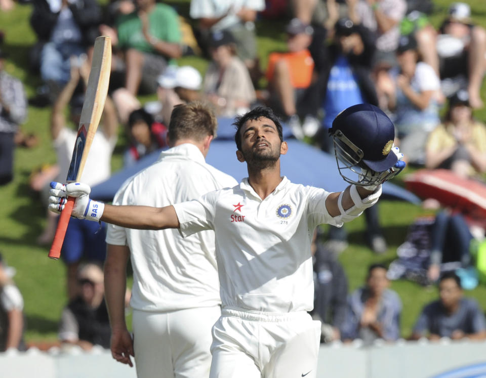 India’s Ajinkya Rahane celebrates his first test century against New Zealand on the second day of the second cricket test in Wellington, New Zealand, Saturday, Feb. 15, 2014.