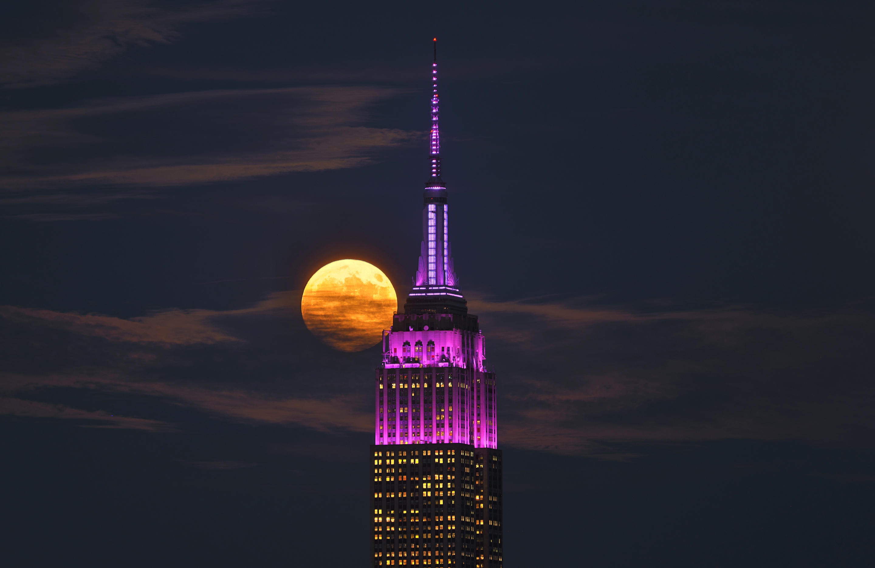 The full Harvest Supermoon rises behind the Empire State Building, Sept. 17. (Gary Hershorn/Getty Images)