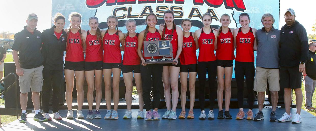 Head coach Tony Thoreson, second from right, is pictured with the Brandon Valley girls team that won the State AA title recently in the 2023 State High School Cross Country Championships at Yankton Trail Park in Sioux Falls.