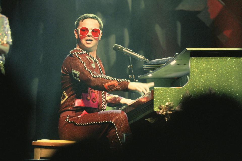 Rus Anderson, in a costume from Elton John's 1973 concert at the Hollywood Bowl show. Anderson portrays the pop star in reenacted concert footage from the '70s that is projected on large screens during John's “Farewell Yellow Brick Road” tour.