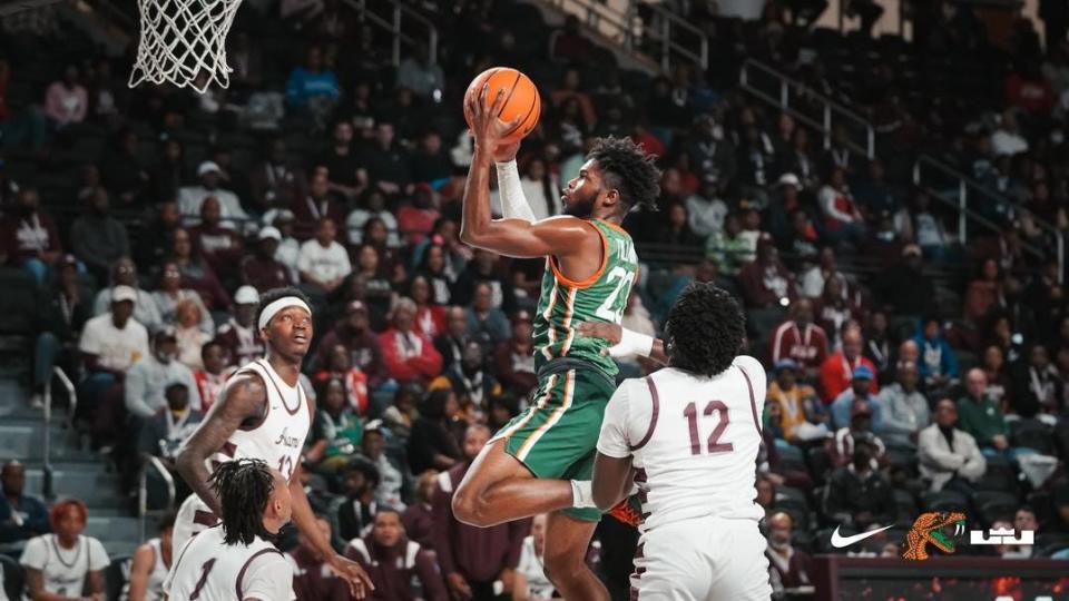 Florida A&M basketball guard Jordan Tillmon (with ball) attempts a layup against Alabama A&M at the Events Center in Huntsville, Alabama, Monday, Feb. 20, 2023