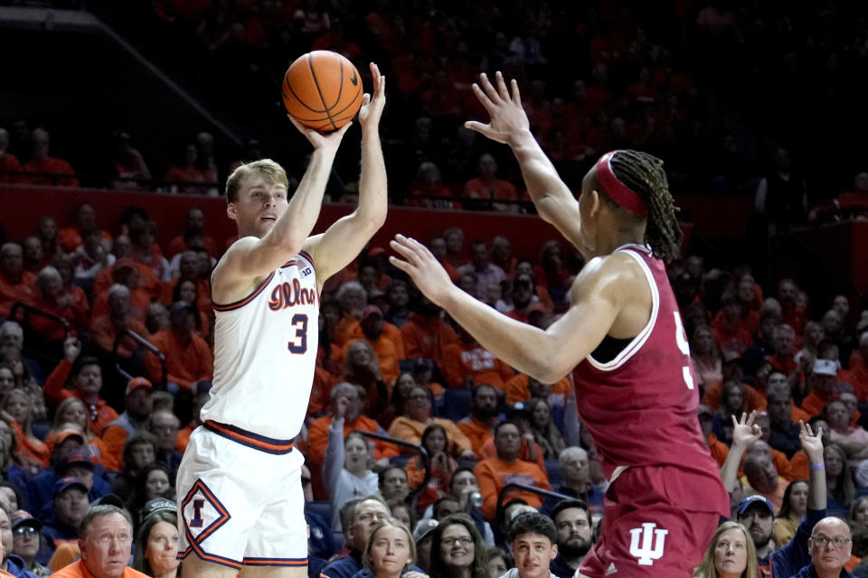 Illinois' Marcus Domask (3) shoots as Indiana's Malik Reneau defends during the first half of an NCAA college basketball game, Saturday, Jan. 27, 2024, in Champaign, Ill. (AP Photo/Charles Rex Arbogast)