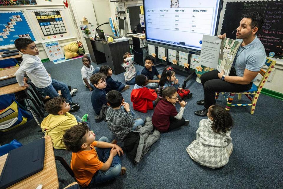 First-grade teacher Luis Ortiz goes over vowels with his students during class at South Hi Mount Elementary in Fort Worth on Tuesday, Dec. 5, 2023.